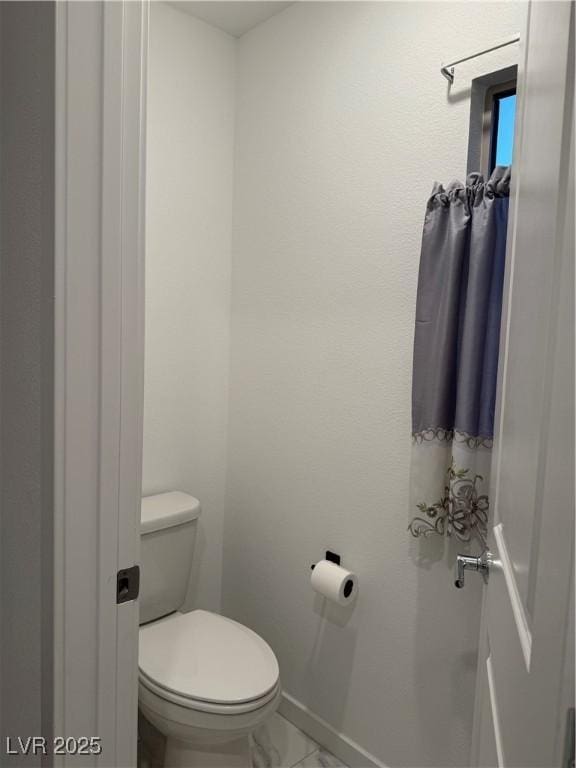 bathroom featuring toilet