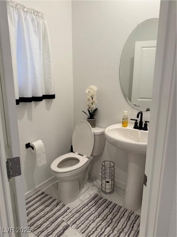 bathroom with toilet and sink