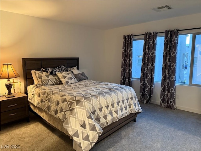 carpeted bedroom featuring multiple windows