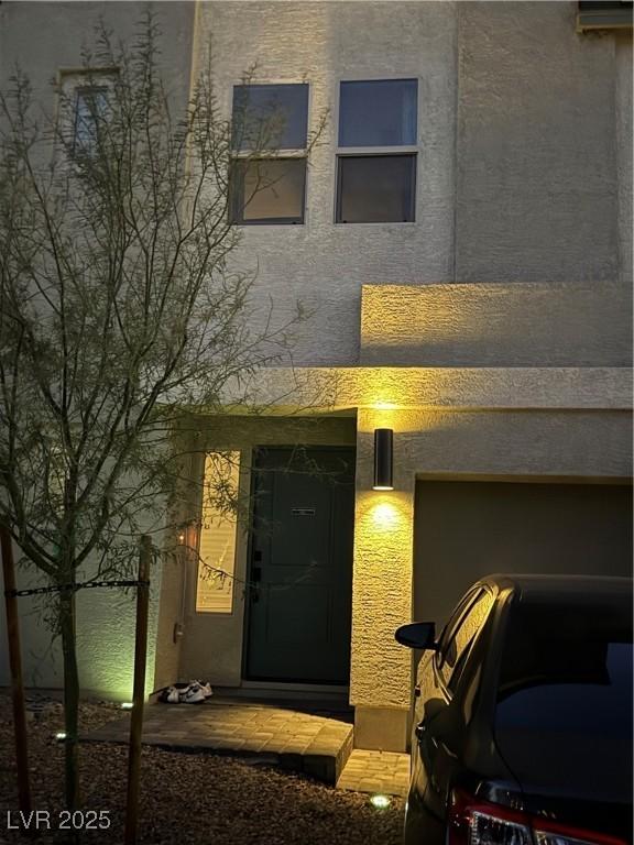 entrance to property featuring a garage