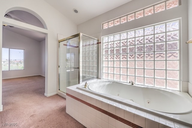 bathroom featuring vaulted ceiling and shower with separate bathtub