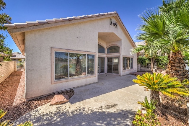 back of house with a patio area