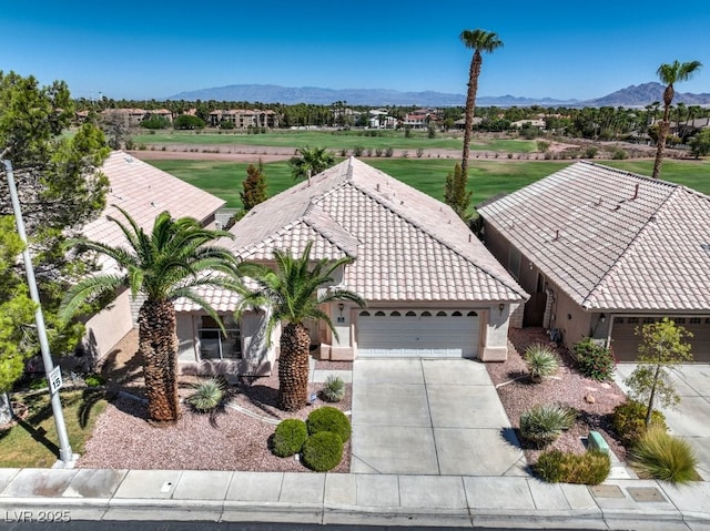 birds eye view of property with a mountain view