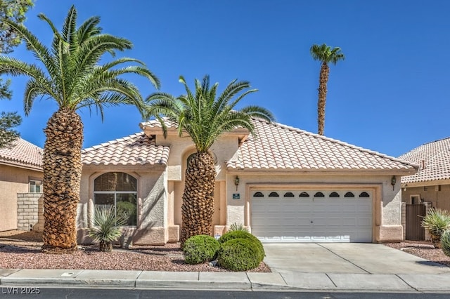 mediterranean / spanish-style house featuring a garage