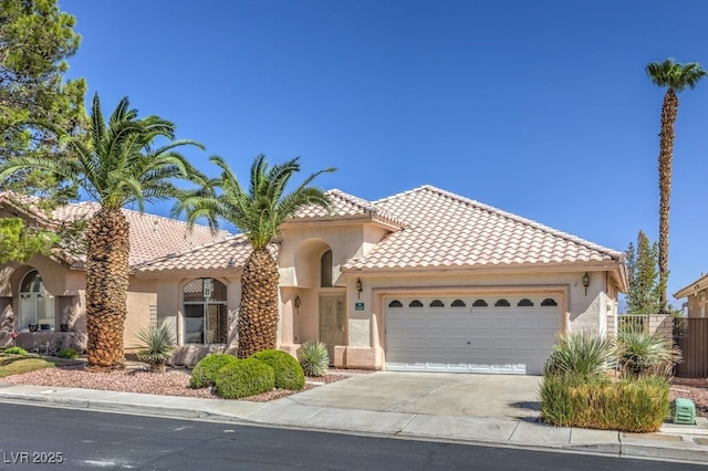 mediterranean / spanish house featuring a garage