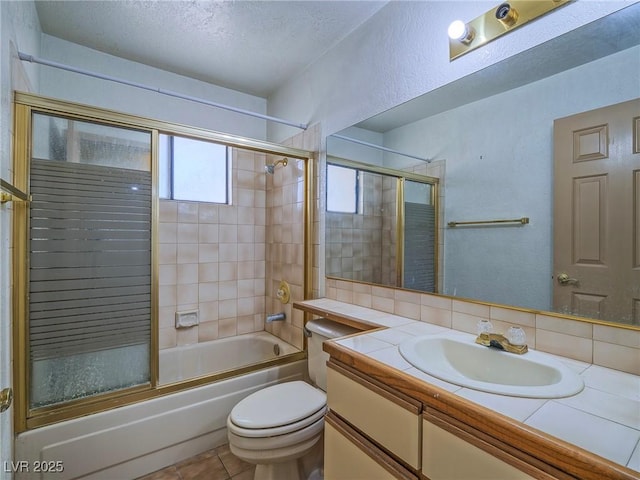 full bathroom with a textured ceiling, enclosed tub / shower combo, vanity, backsplash, and toilet