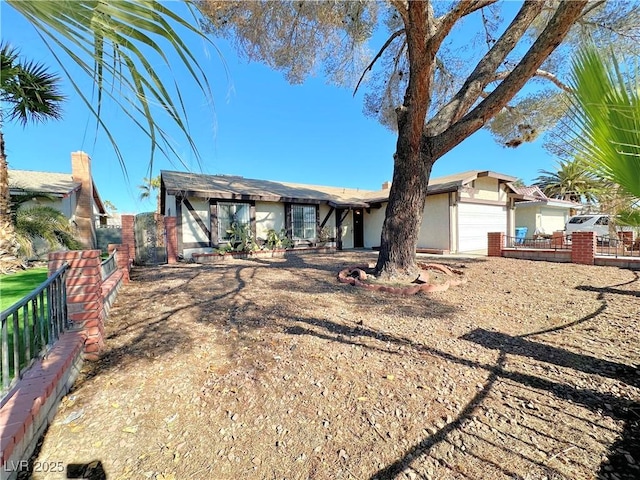 single story home featuring a garage