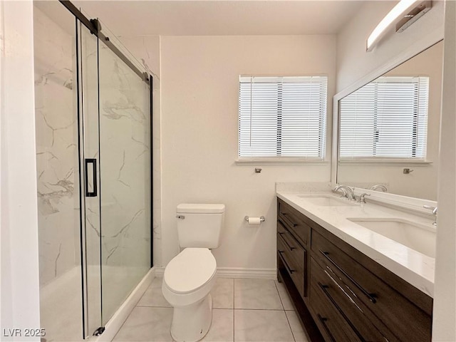 bathroom with tile patterned flooring, toilet, walk in shower, and vanity