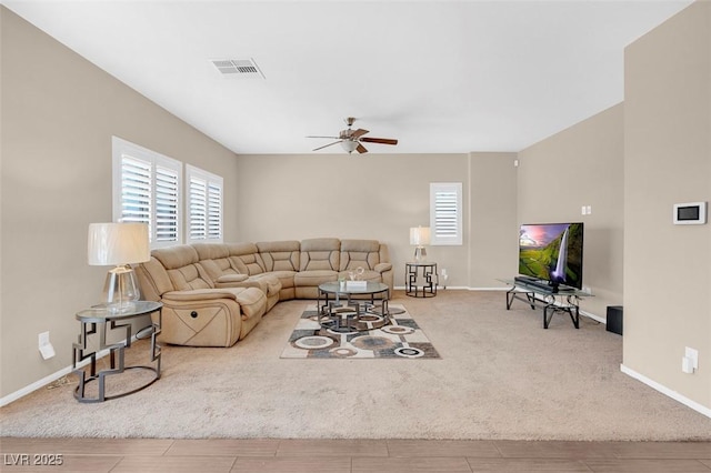 living room featuring ceiling fan and wood-type flooring