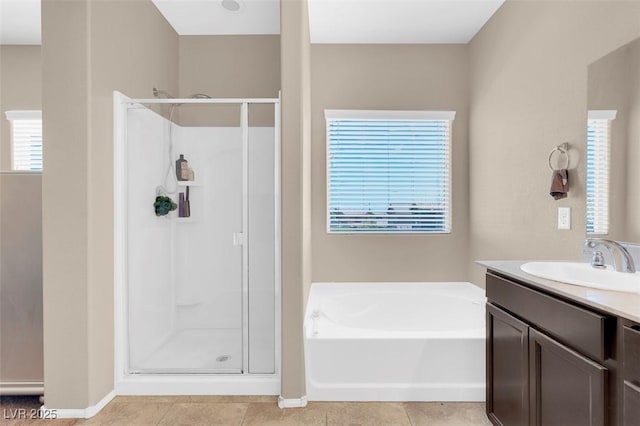 bathroom featuring vanity, tile patterned floors, and independent shower and bath