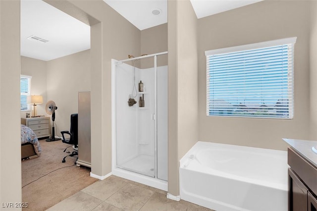 bathroom with vanity, tile patterned floors, and shower with separate bathtub