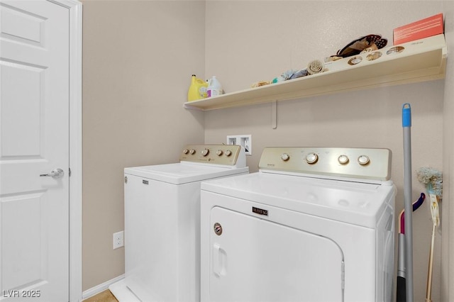 laundry area featuring washing machine and clothes dryer