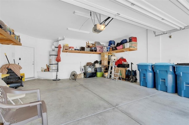 garage with a garage door opener and strapped water heater