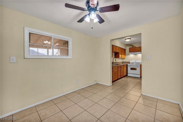 interior space featuring ceiling fan and sink