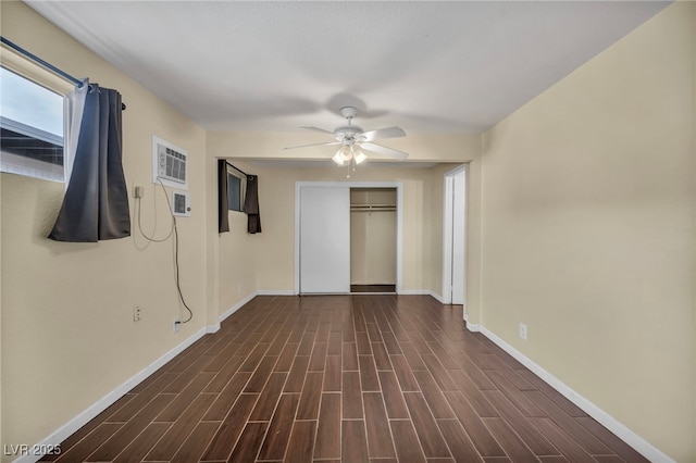 unfurnished bedroom featuring ceiling fan and a closet