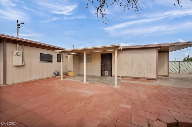 rear view of property featuring a patio area