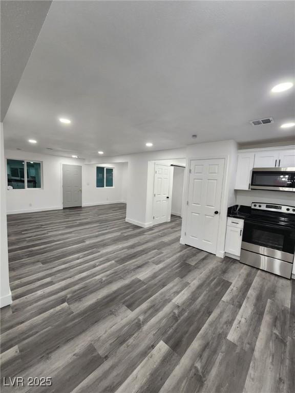 interior space with dark hardwood / wood-style floors