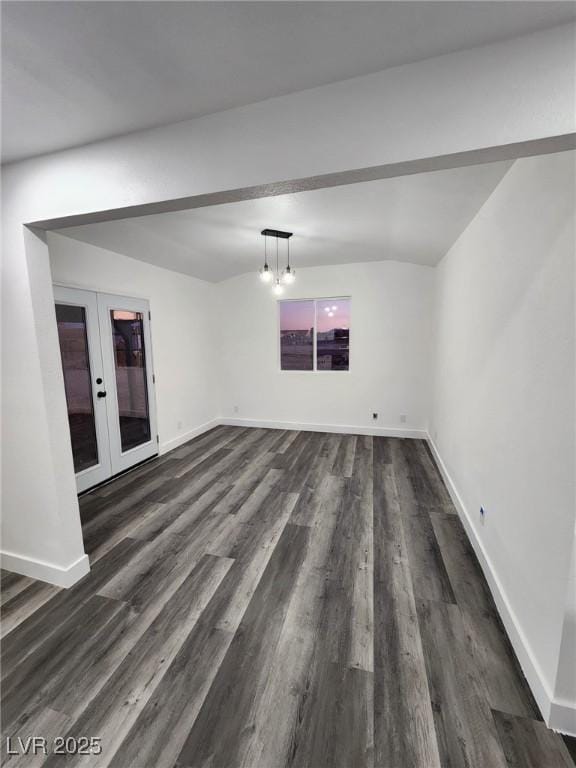 empty room with french doors and dark hardwood / wood-style floors