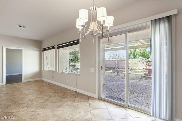 unfurnished dining area with visible vents, a notable chandelier, baseboards, and light tile patterned floors