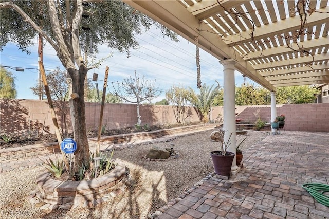 view of patio featuring a fenced backyard and a pergola