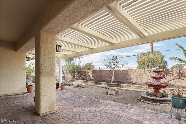 view of patio / terrace with a fenced backyard and a pergola