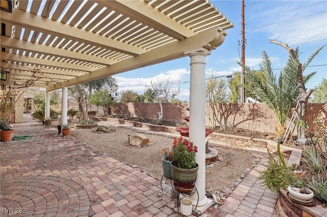 view of patio / terrace with a fenced backyard and a pergola