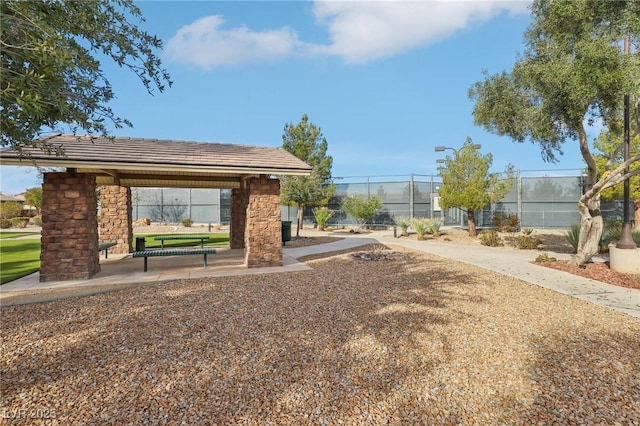 view of home's community featuring a gazebo and fence