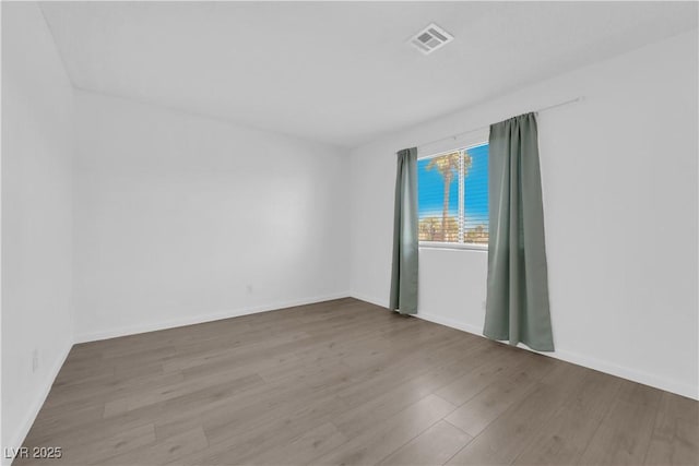 unfurnished room featuring light wood-type flooring