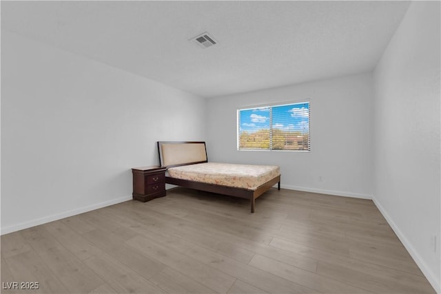 unfurnished bedroom with light hardwood / wood-style floors