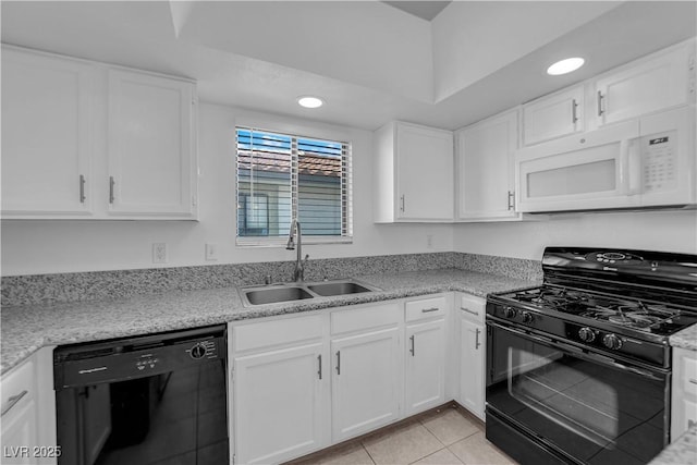 kitchen with sink, white cabinets, black appliances, and light tile patterned flooring