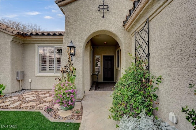 property entrance with a patio area