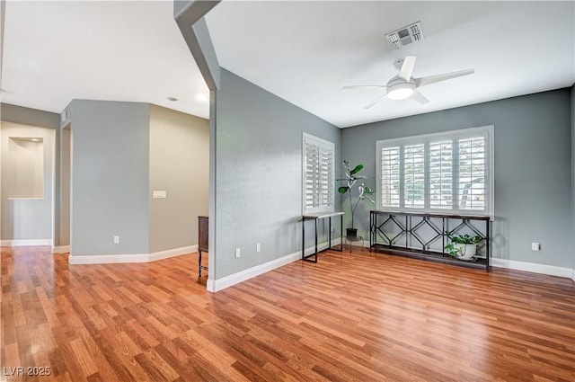 interior space with ceiling fan and light hardwood / wood-style floors