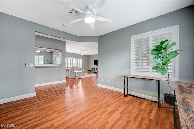 interior space with ceiling fan and light wood-type flooring