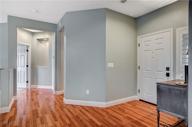 entrance foyer with light hardwood / wood-style floors