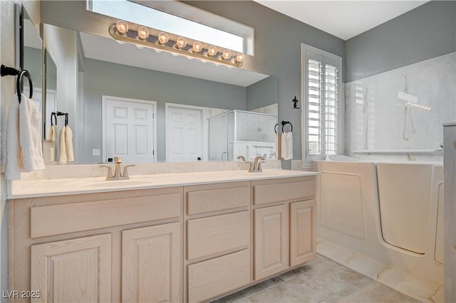 bathroom featuring vanity, independent shower and bath, and tile patterned flooring