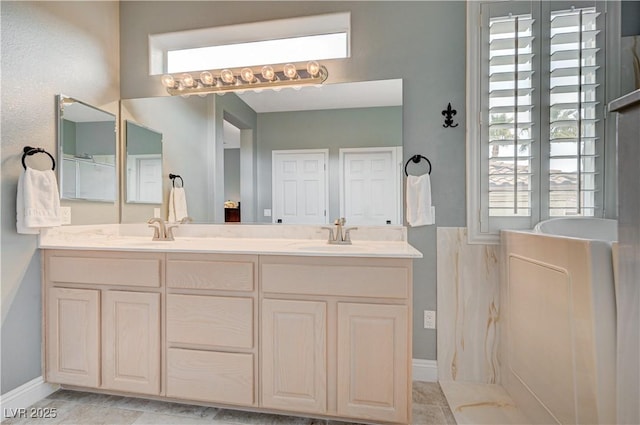 bathroom featuring walk in shower and vanity