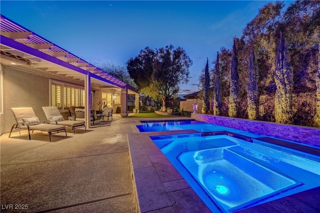 pool at dusk featuring an in ground hot tub, a pergola, and a patio