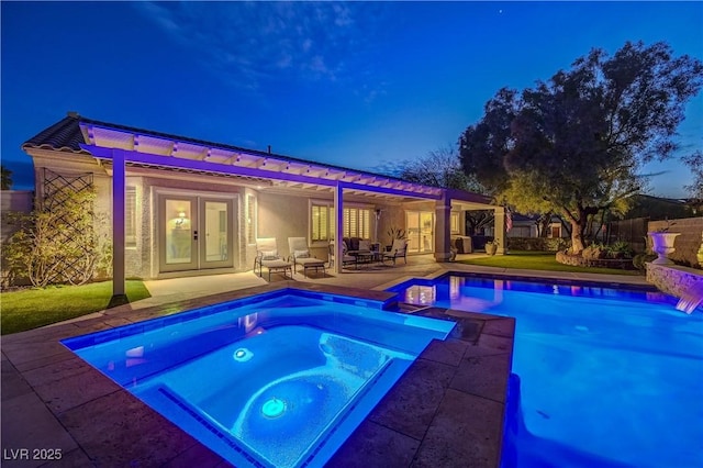 view of swimming pool featuring a patio area, french doors, and an in ground hot tub