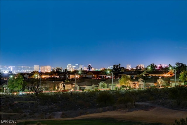 view of back house at dusk