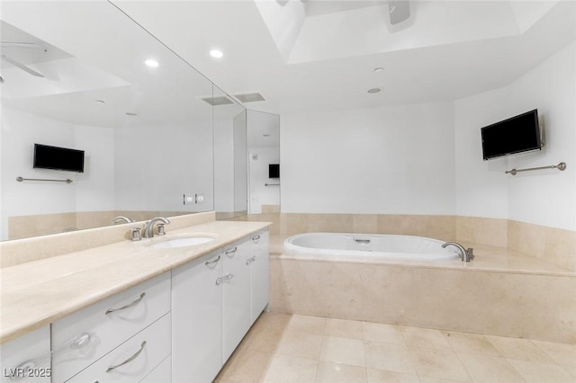 full bath with recessed lighting, tile patterned flooring, a garden tub, and vanity