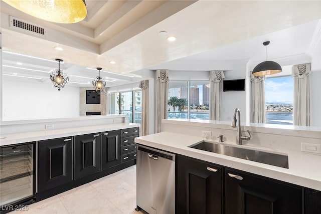 kitchen with beverage cooler, visible vents, light countertops, and dishwasher