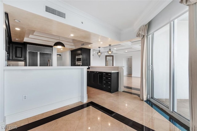 kitchen featuring visible vents, ornamental molding, dark cabinets, paneled refrigerator, and light countertops