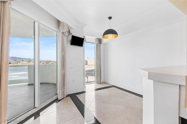 unfurnished dining area with crown molding, baseboards, and light tile patterned floors