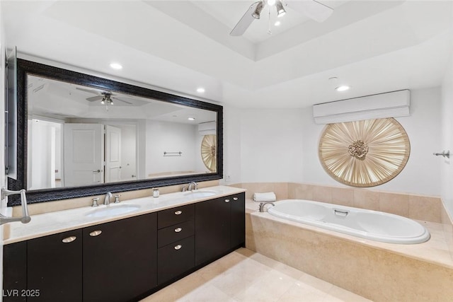 bathroom with double vanity, a raised ceiling, a sink, and recessed lighting