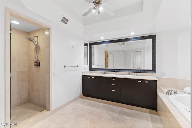 full bath with double vanity, visible vents, a bath, a shower stall, and a sink