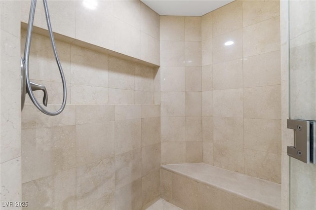 full bathroom with a tile shower