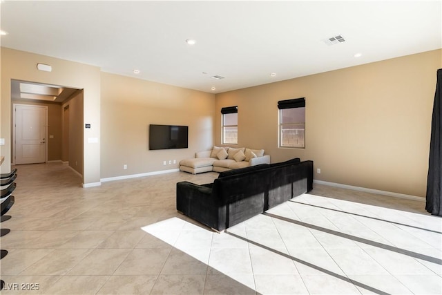 living room with light tile patterned flooring