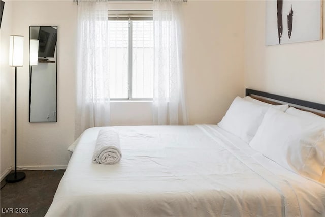 carpeted bedroom featuring multiple windows