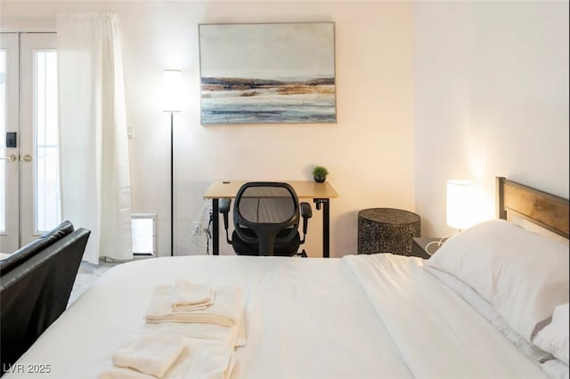 bedroom featuring multiple windows and french doors