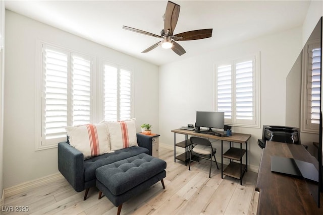 office featuring light hardwood / wood-style floors and ceiling fan